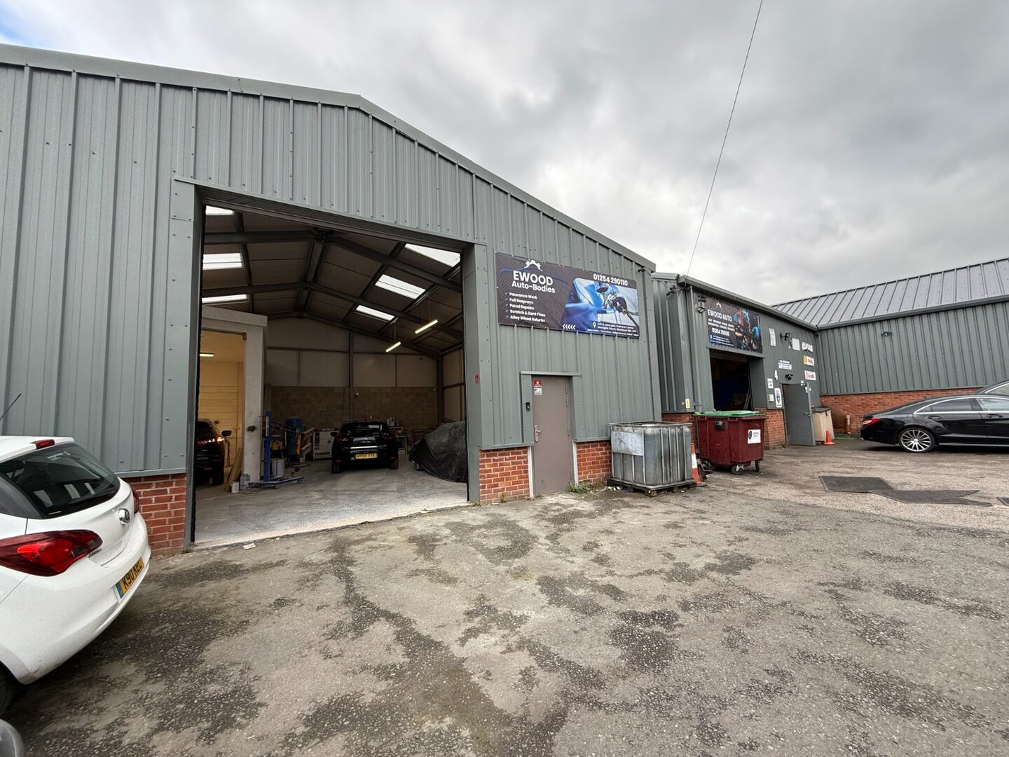 Exterior of the Ewood Autobodies workshop at Moorgate Business Centre in Blackburn with the workshop bays open